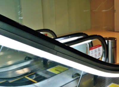 Components of travolators: Handrail lighting
